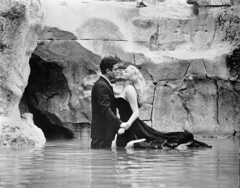 Marcello and Sylvia in the Trevi Fountain in Rome, Italy, one of the La Dolce Vita filming locations