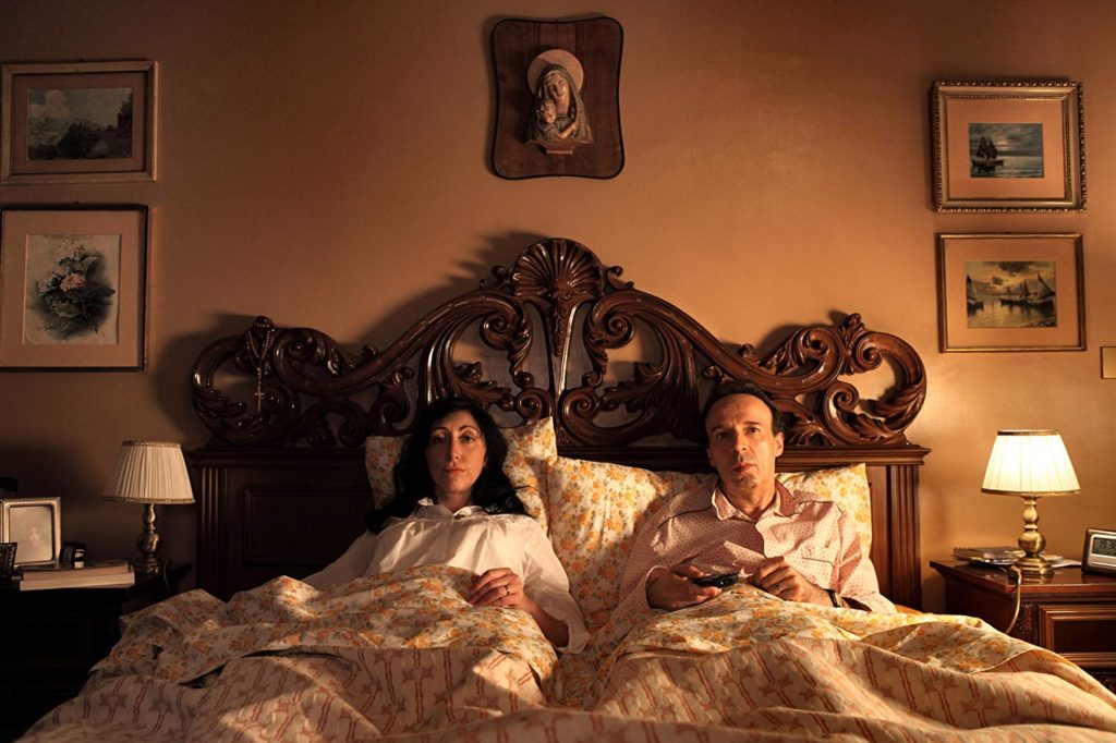Leopoldo is at home in bed with his wife in To Rome with Love (2012)