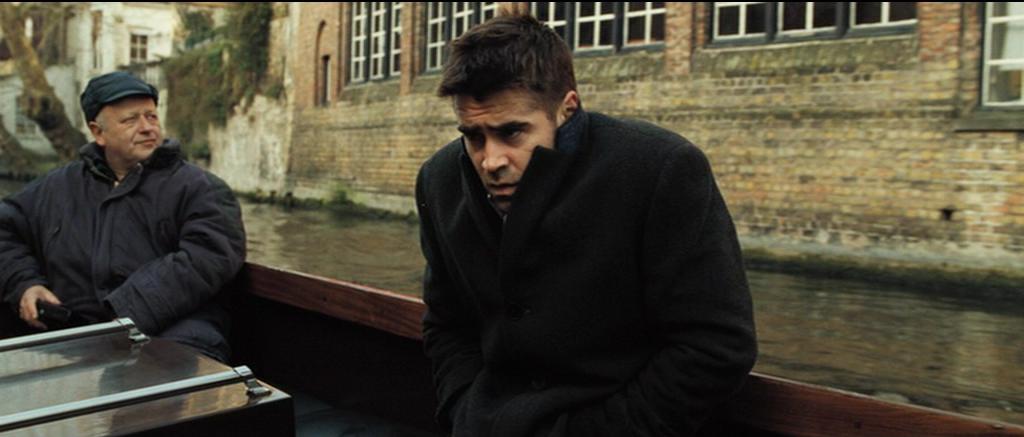 Ray (Colin Farrell) on a canal boat one of the In Bruges filming locations