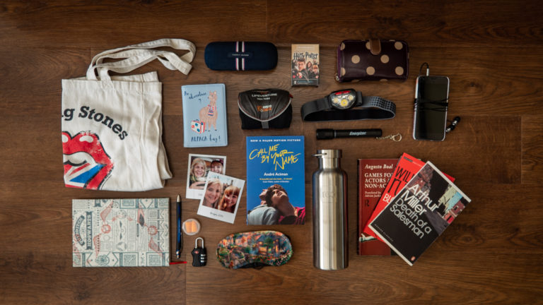 Flatlay of gear and essentials camp counsellors should pack for summer camp