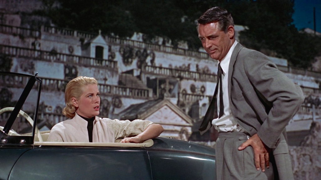To Catch a Thief (1955) film still of Cary Grant and Grace Kelly in the convertible at the Cemetary in the French Riviera