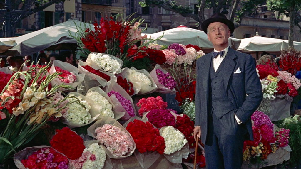 To Catch a Thief (1955) film still of the insurance man at Nice Flower Market in the South of France