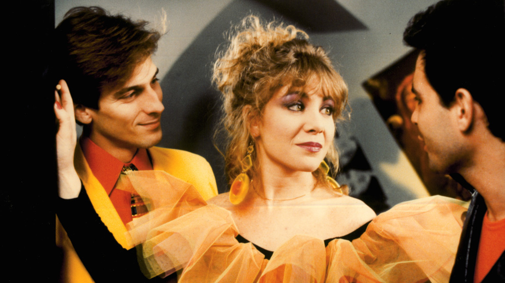 Labyrinth of Passion (1982) film still of two men and a woman in 1980s clothes