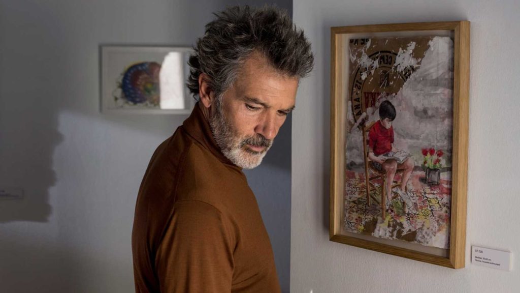 Pain and Glory (2019) film still of Antonio Banderas in an art gallery in Madrid, Spain