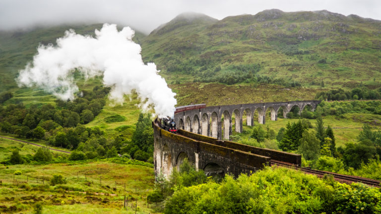 Jacobite Harry Potter Steam Train crossing Glenfinnan Viaduct, Scotland