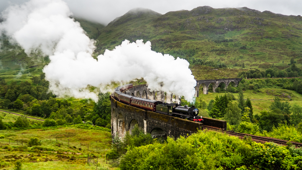 Jacobite Harry Potter Steam Train crossing Glenfinnan Viaduct, Scotland