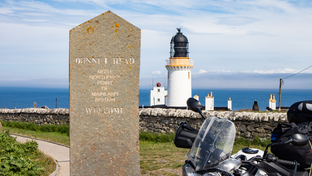 Dunnet Head Lighthouse and Sign on the North Coast 500 in Scotland