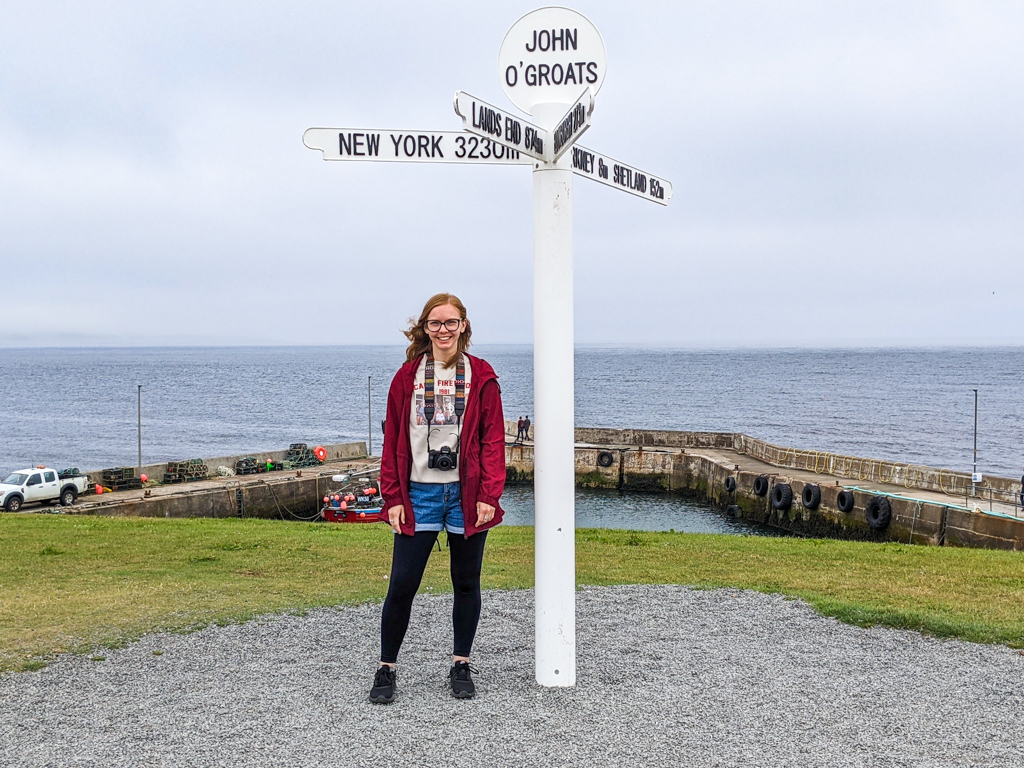 Almost Ginger blog owner at John O'Groats Sign in Scotland on the North Coast 500