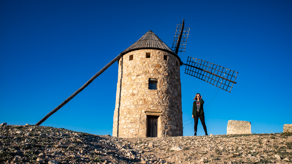 Almost Ginger blog owner next to a windmill in Castilla-La Mancha