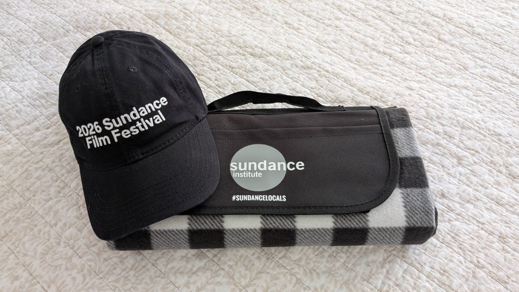 2026 Sundance Film Festival branded baseball cap and Sundance Institute black and grey picnic banket raffle prize